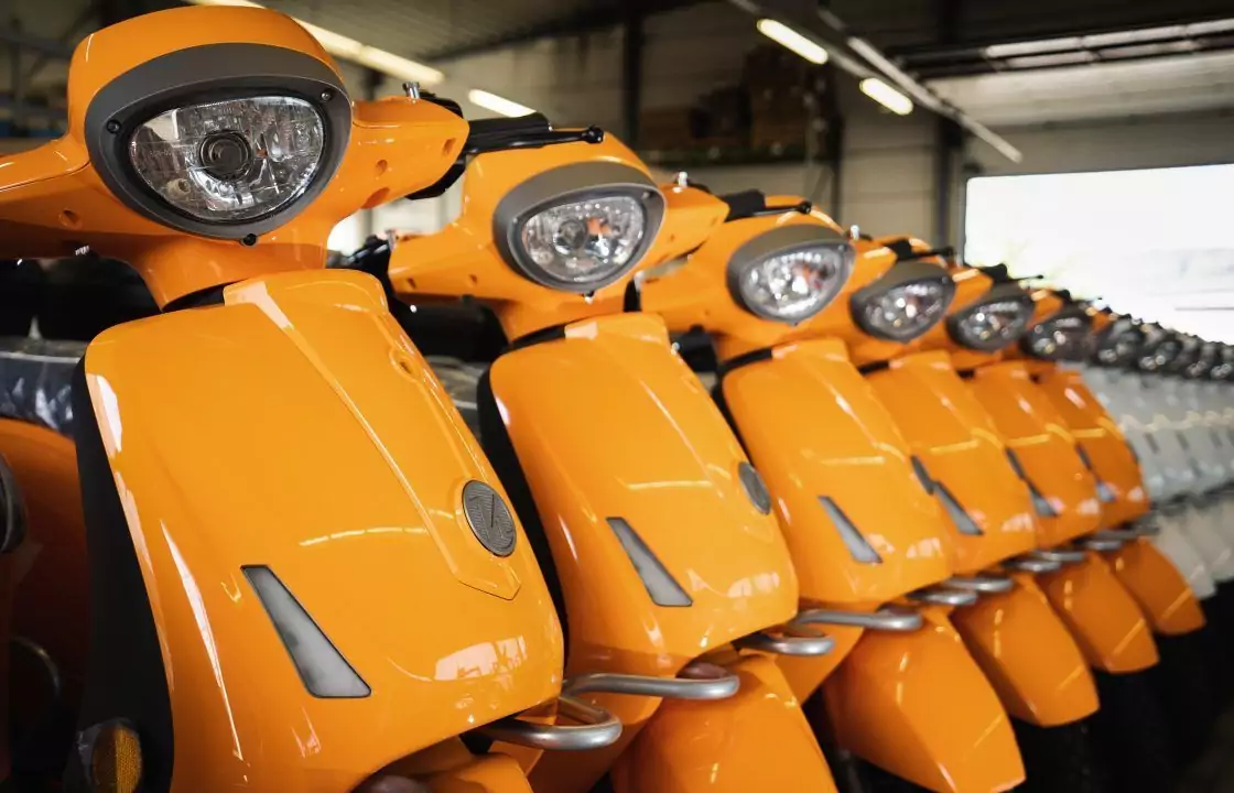 A line of mass-produced scooters