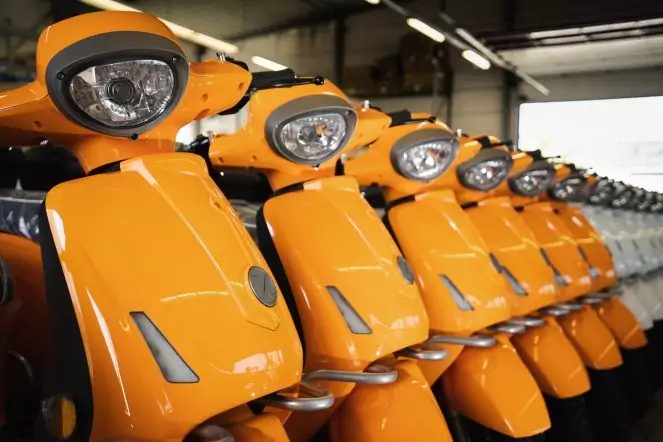 A line of mass-produced scooters